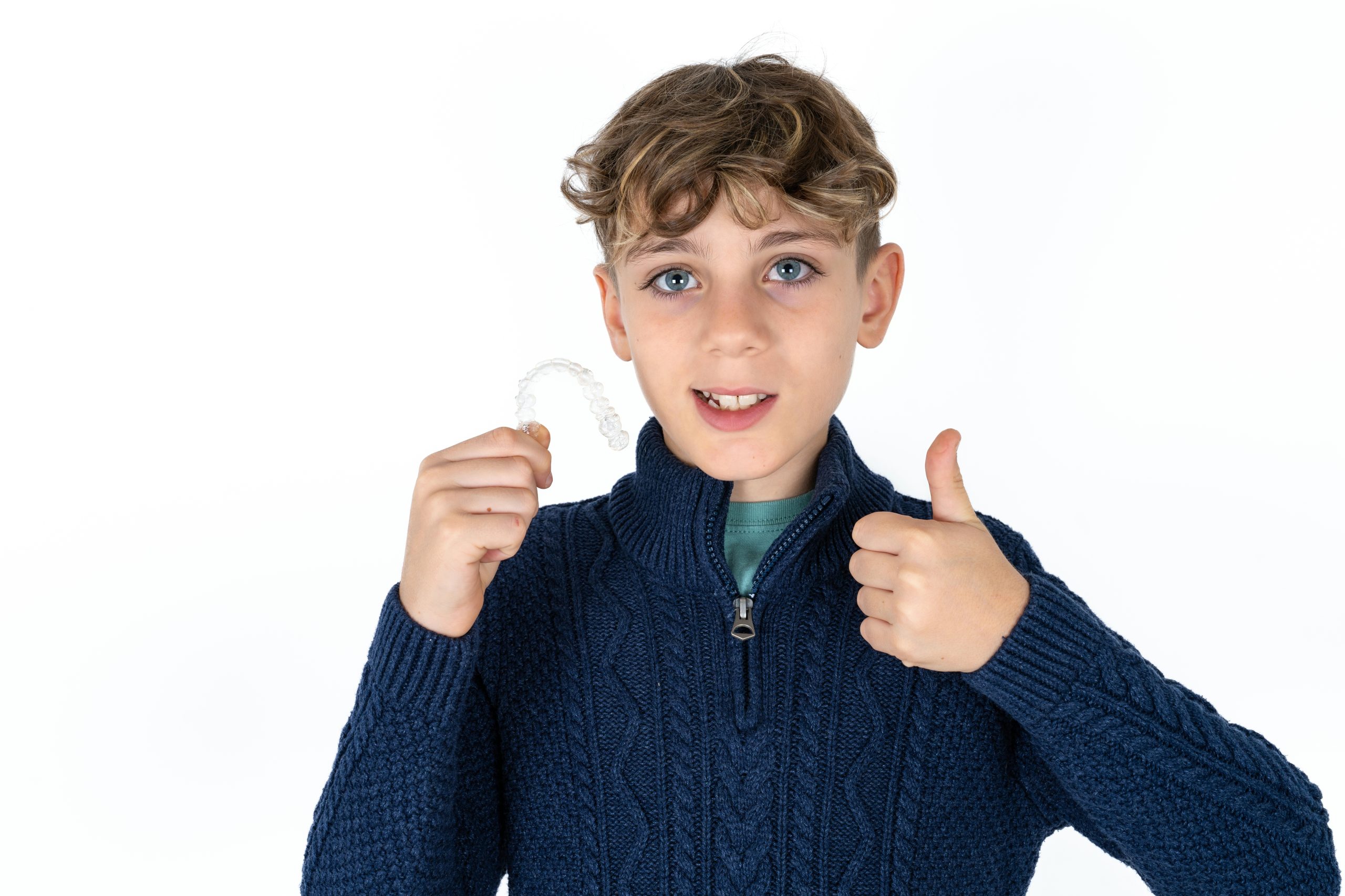 Happy,Caucasian,Teen,Boy,Holding,An,Invisible,Braces,Aligner,And